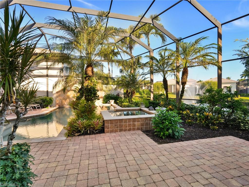 9113 Terrabella Court Naples, FL 34109 - Photo 46 of 47 a house with trees in front of it