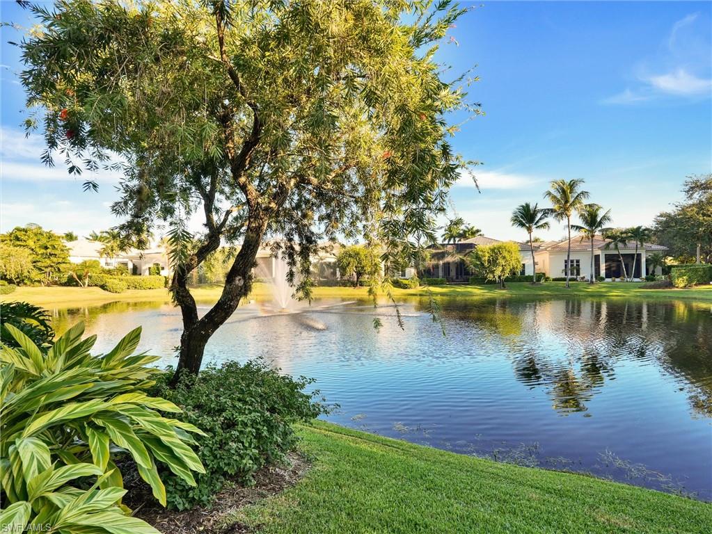 9113 Terrabella Court Naples, FL 34109 - Photo 47 of 47 a view of a lake with houses