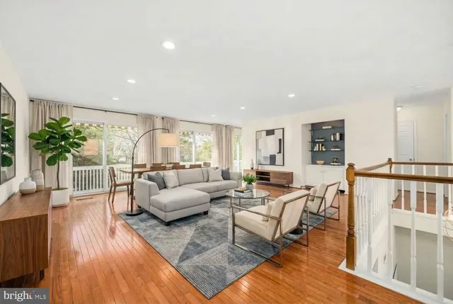 a balcony with trees in front of it