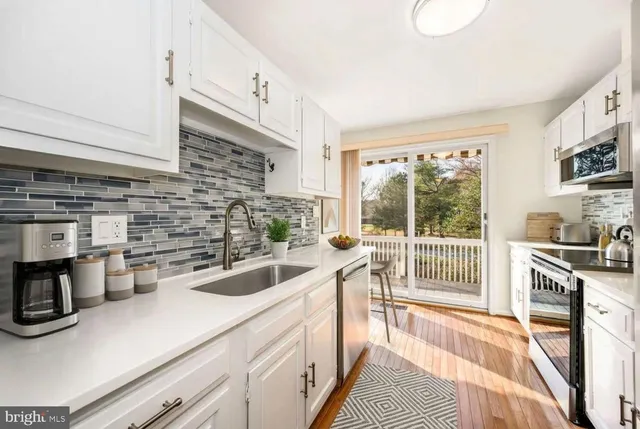 a spacious bedroom with a large bed and a couch