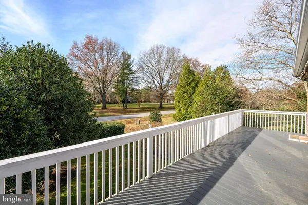 a balcony with trees in front of it