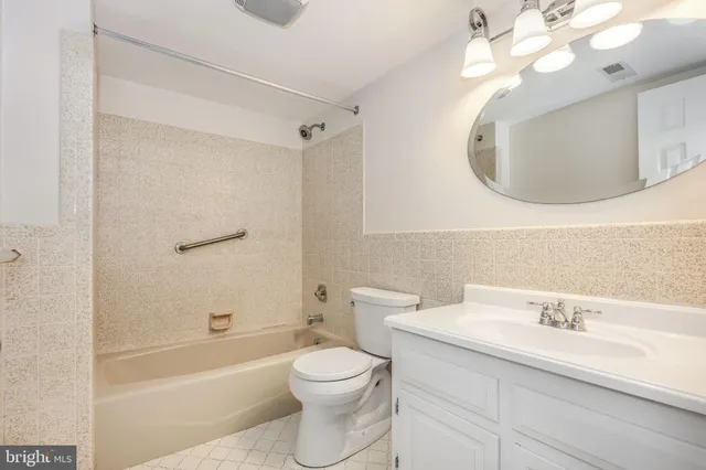 an aerial view of a houses with a lake view