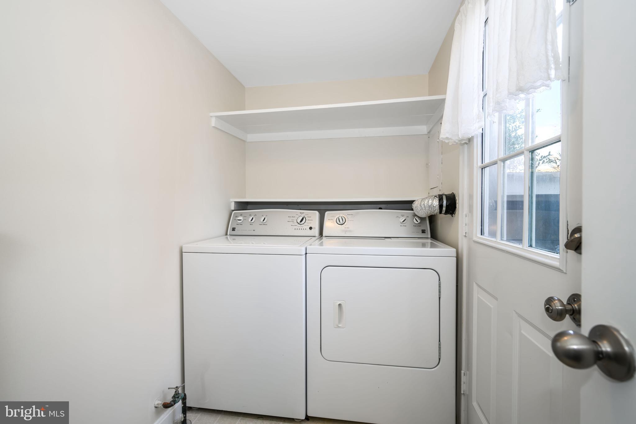 24700 Deepwater Point Drive, Unit 1 St. Michaels, MD 21663 - Photo 28 of 47 a utility room with dryer and washer