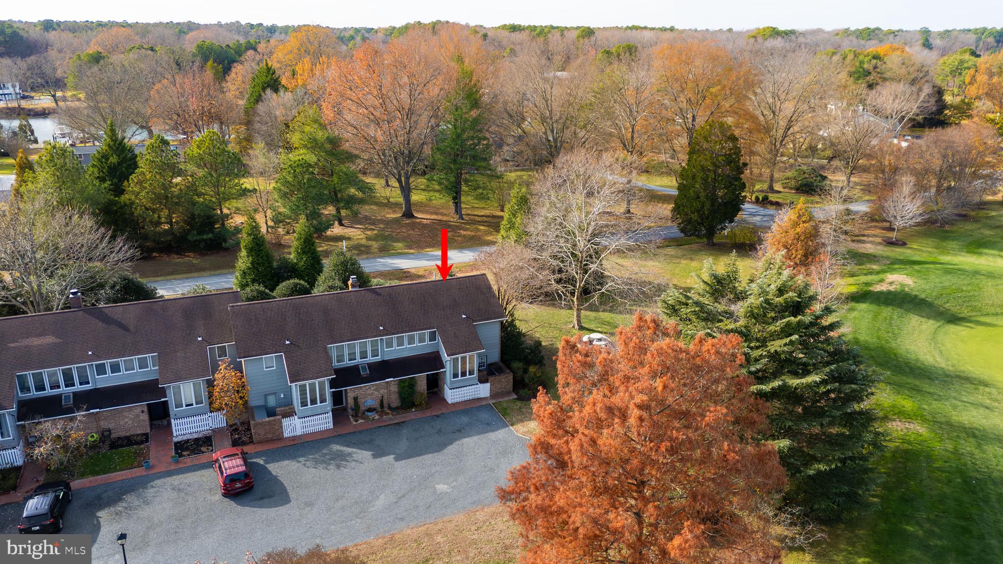 24700 Deepwater Point Drive, Unit 1 St. Michaels, MD 21663 - Photo 6 of 47 a view of a house with a garden