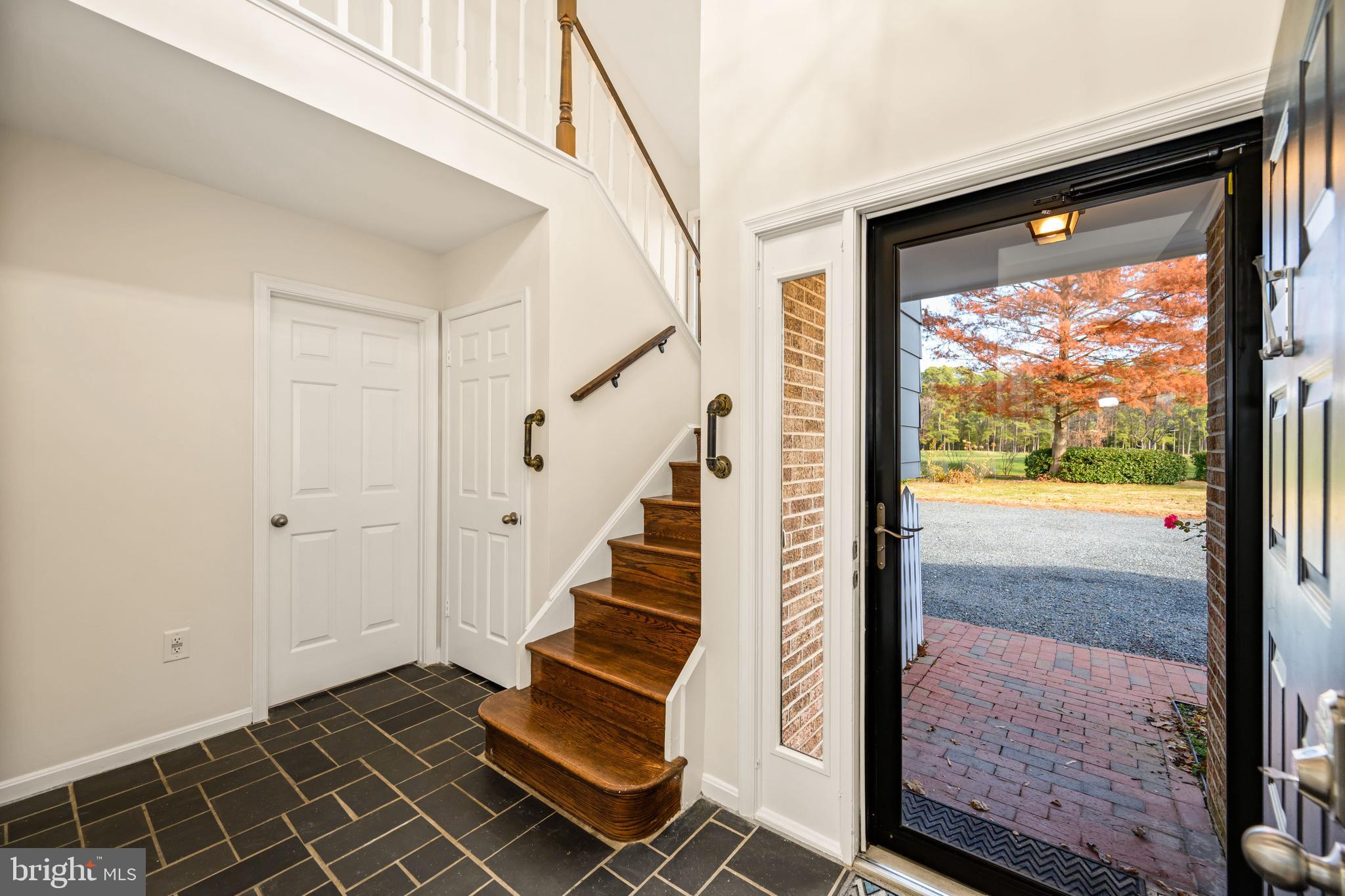 24700 Deepwater Point Drive, Unit 1 St. Michaels, MD 21663 - Photo 7 of 47 a view of an entryway with staircase