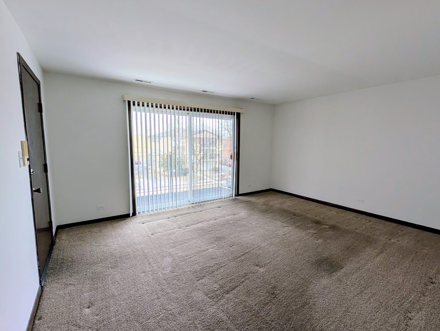 8143 Marion Drive, Unit 3E Justice, IL 60458 - Photo 2 of 9 a view of an empty room with a window