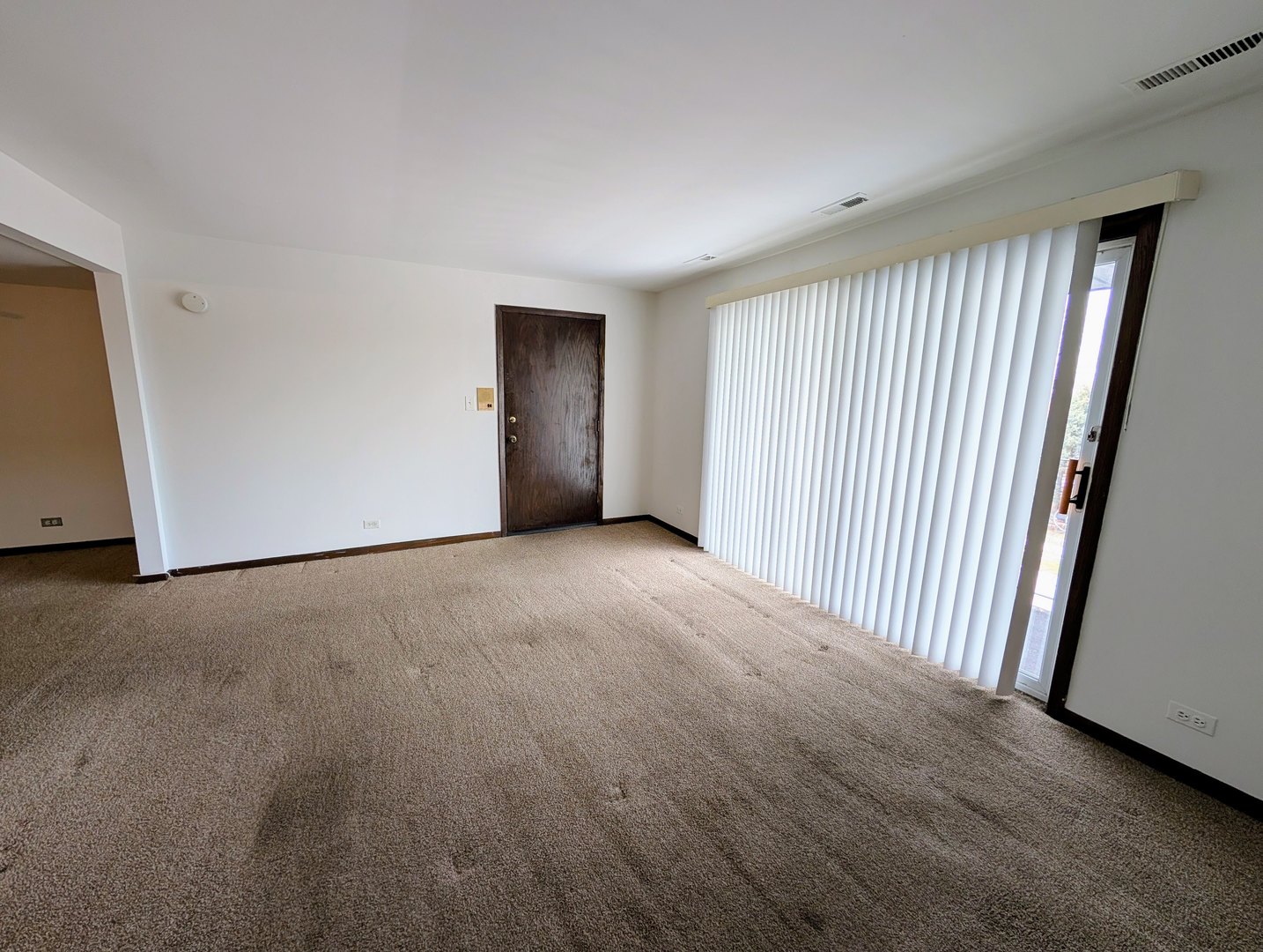 8143 Marion Drive, Unit 3E Justice, IL 60458 - Photo 3 of 9 an empty room with windows