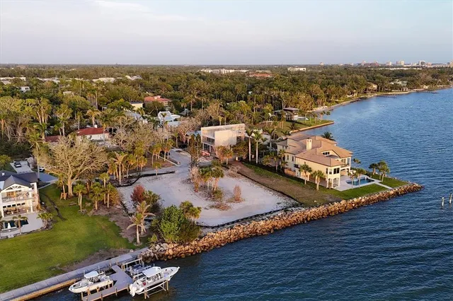 an aerial view of a houses with a ocean view