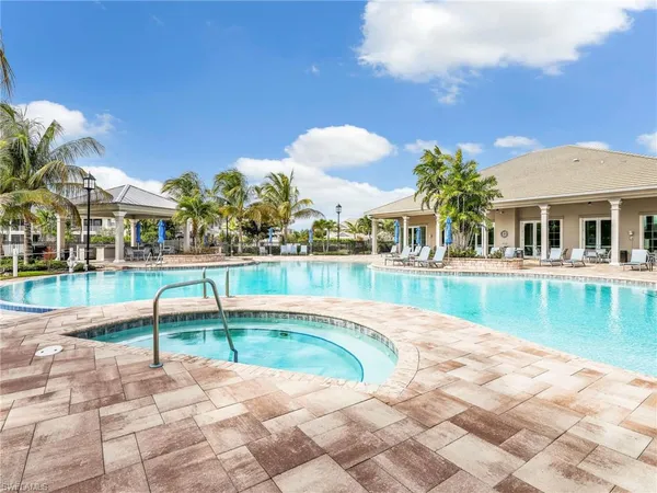 a kitchen with a sink dining table and chairs