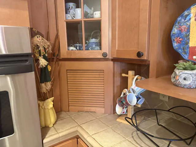 a view of a room with rack and furniture