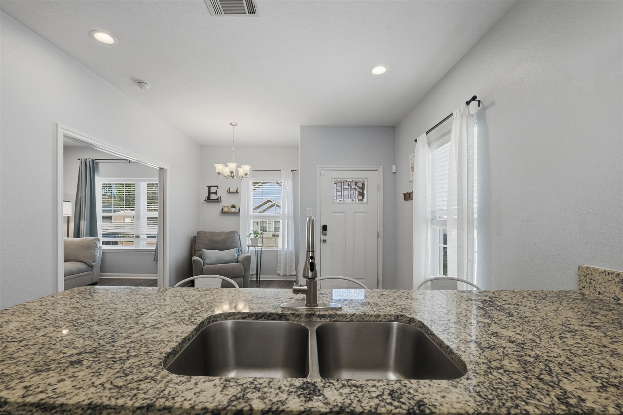16879 Balmoral Street Montgomery, TX 77316 - Photo 13 of 25 Open-concept kitchen overlooking dining area and separate living space.