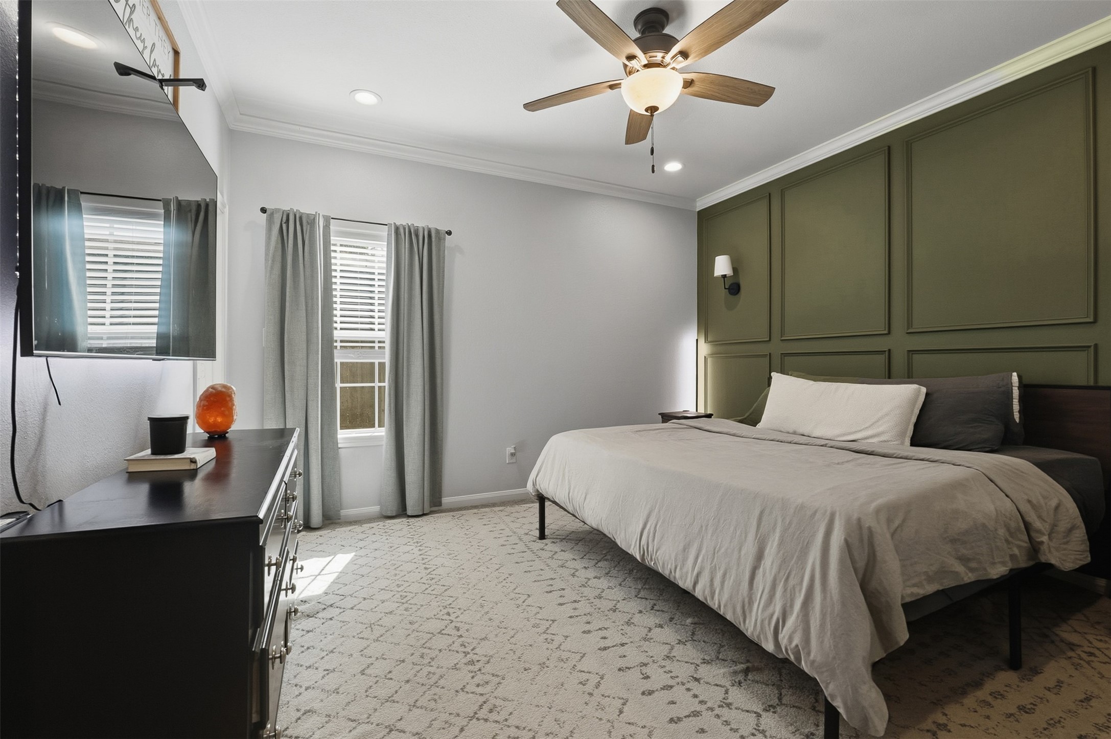 16879 Balmoral Street Montgomery, TX 77316 - Photo 16 of 25 a bedroom with a large bed and a chandelier