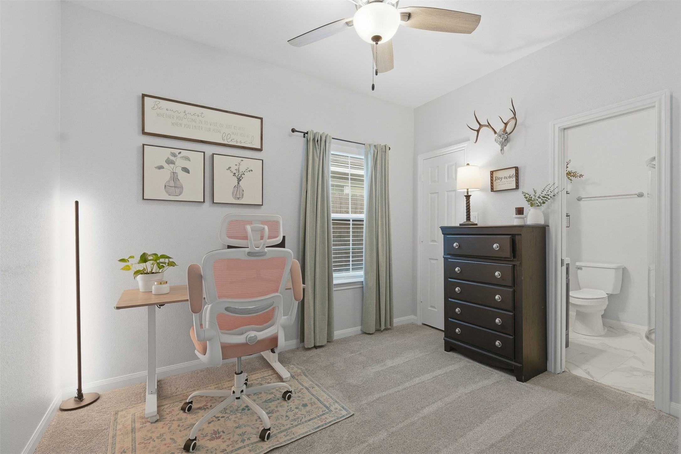 16879 Balmoral Street Montgomery, TX 77316 - Photo 18 of 25 a spacious bedroom with a bed and a cabinets