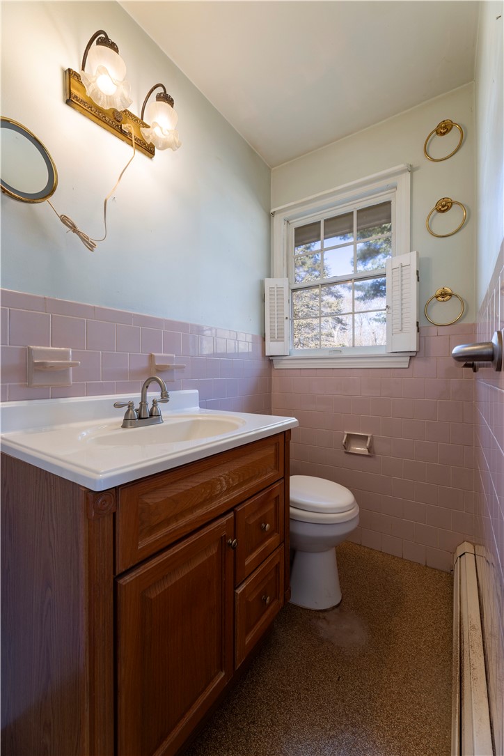 1037 Great Road Lincoln, RI 02865 - Photo 13 of 33 Half bath off primary bedroom