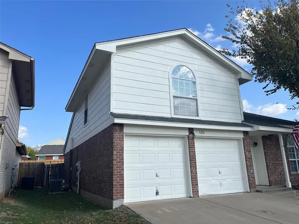 a view of a house with a garage