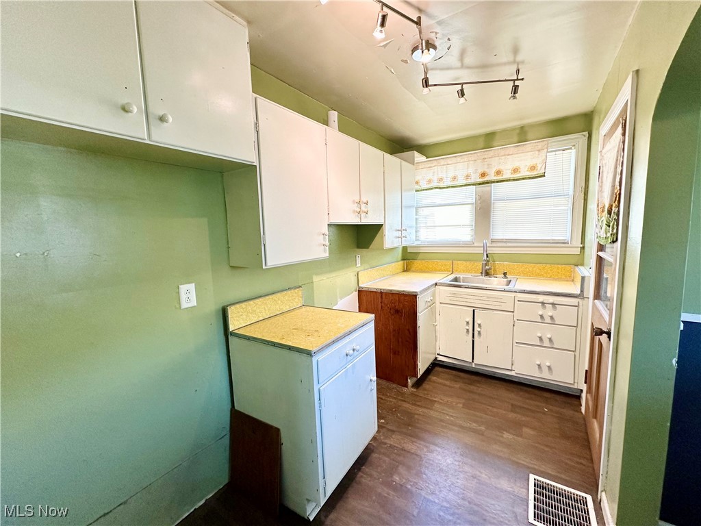 87 R 26th Street Wellsburg, WV 26070 - Photo 5 of 17 Kitchen with cabinets, wood-style flooring, and a sink