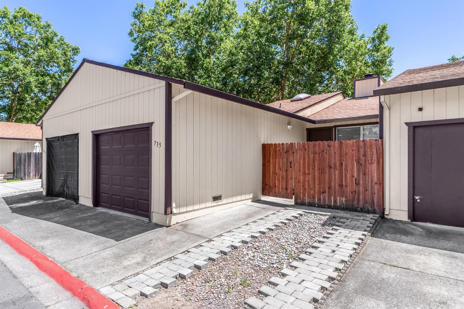735 Blair Place Santa Rosa, CA 95401 - Photo 6 of 16 a view of backyard with small cabin and wooden fencing