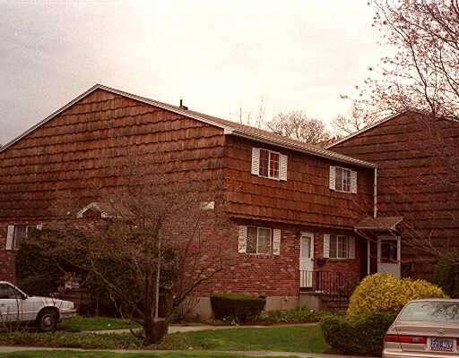 a brick building with a yard