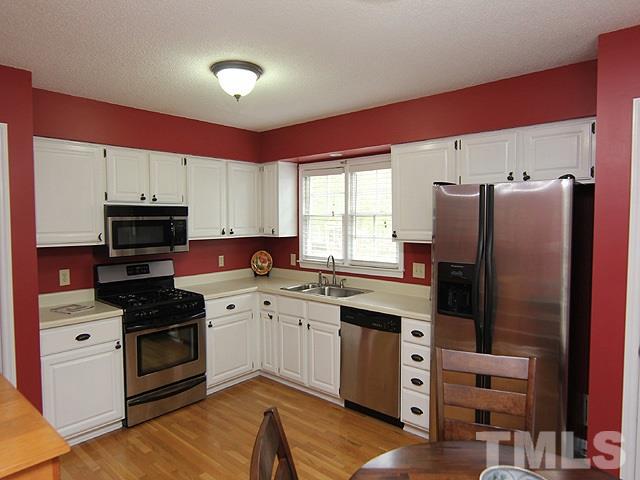 4952 Royal Adelaide Way Raleigh, NC 27604 - Photo 7 of 25 Stainless Steel Appliances, Gleaming Hardwood Floors on the main level! Pantry; Gas Stove! Immaculate.