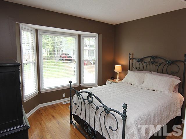 4952 Royal Adelaide Way Raleigh, NC 27604 - Photo 9 of 25 Beautiful hardwoods in first floor bedroom with full bath; perfect for guests or roommate situation.