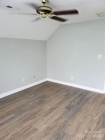 a bedroom with furniture and a flat screen tv