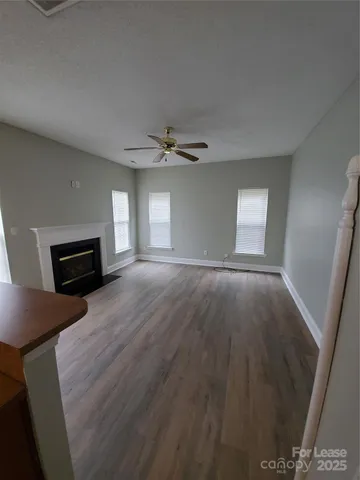 a view of livingroom with hardwood floor and a ceiling fan