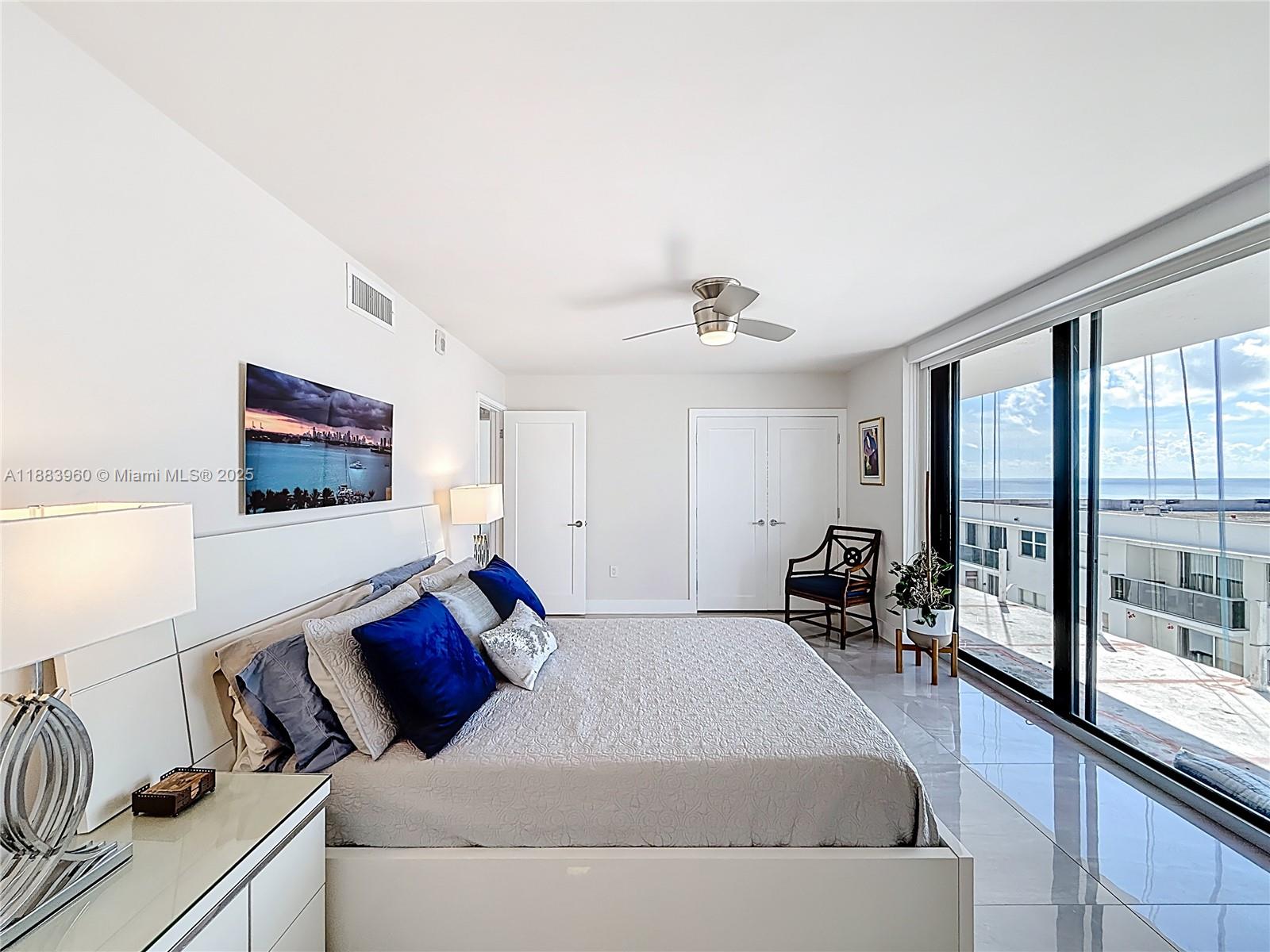 6061 Collins Avenue, Unit 20C Miami Beach, FL 33140 - Photo 14 of 29 a living room with furniture and a floor to ceiling window