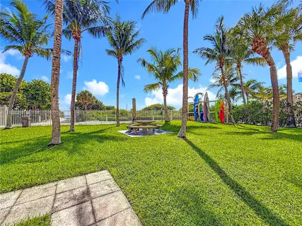 a view of a park with palm trees