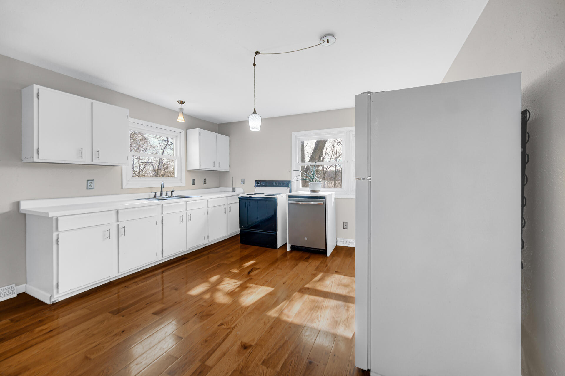 65720 Highway 4 Walkerton, IN 46574 - Photo 11 of 35 a kitchen with a sink window and cabinets