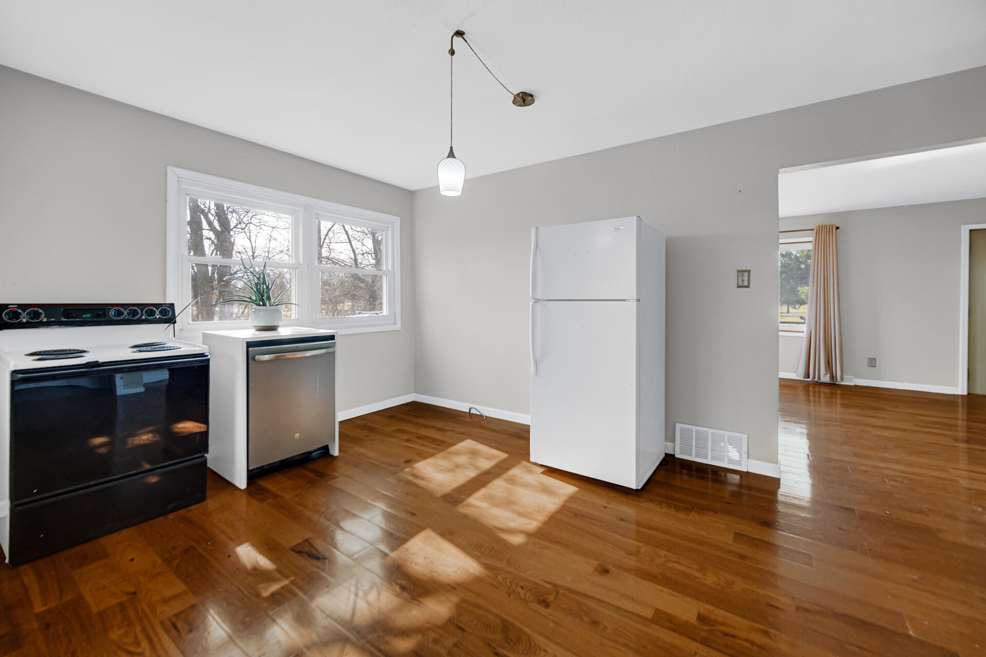 65720 Highway 4 Walkerton, IN 46574 - Photo 12 of 35 a kitchen with a stove and a white kitchen