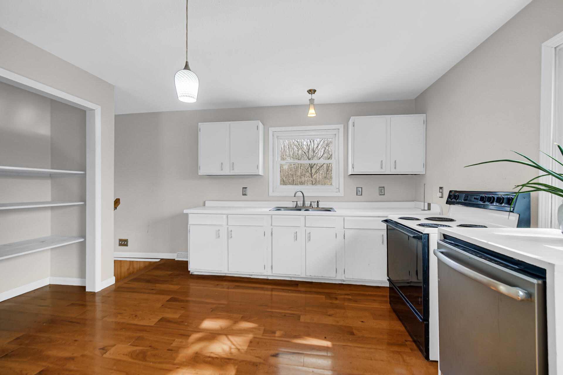 65720 Highway 4 Walkerton, IN 46574 - Photo 13 of 35 a kitchen with a sink cabinets and window