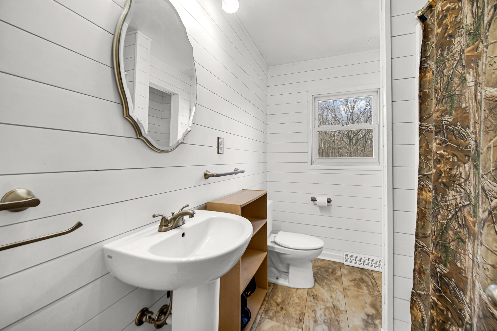 65720 Highway 4 Walkerton, IN 46574 - Photo 20 of 35 a bathroom with a sink toilet and a mirror