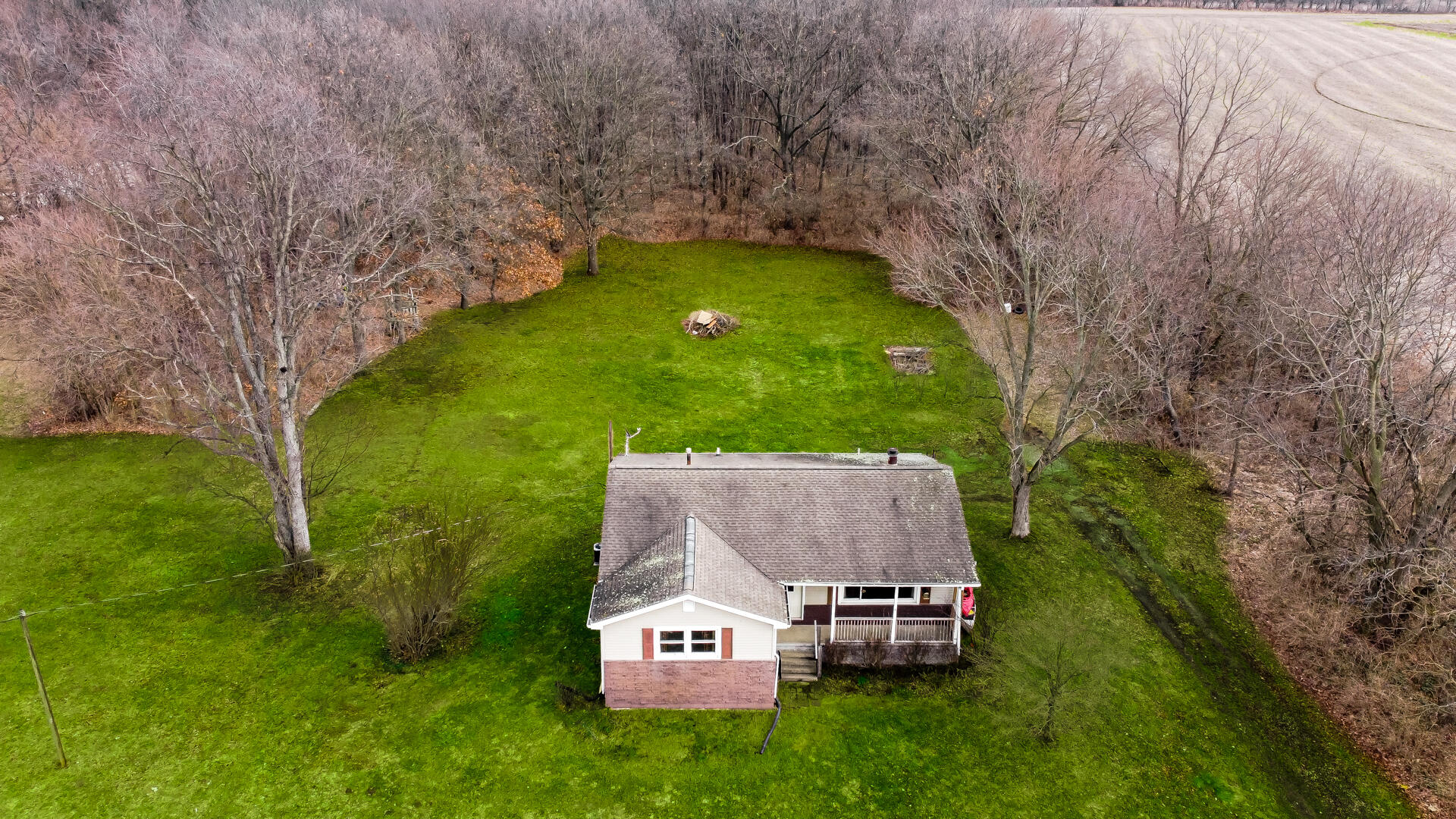65720 Highway 4 Walkerton, IN 46574 - Photo 2 of 35 a aerial view of a house with a garden