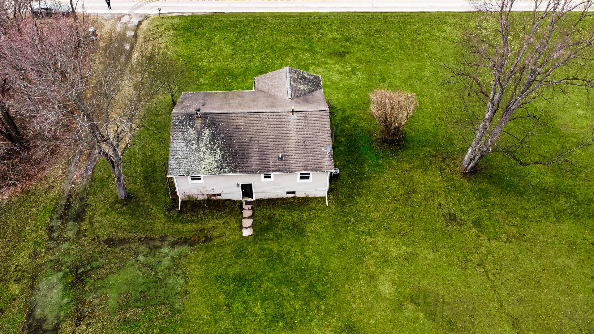65720 Highway 4 Walkerton, IN 46574 - Photo 24 of 35 an aerial view of a house with a garden