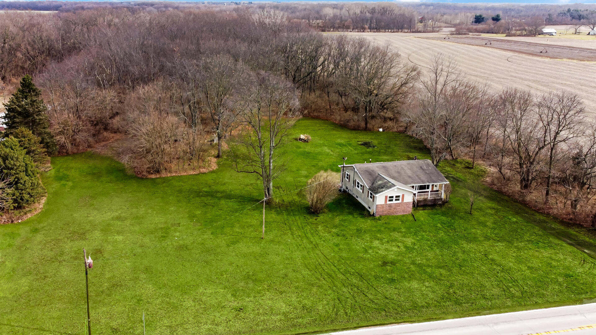 65720 Highway 4 Walkerton, IN 46574 - Photo 27 of 35 a backyard of a house with lots of green space