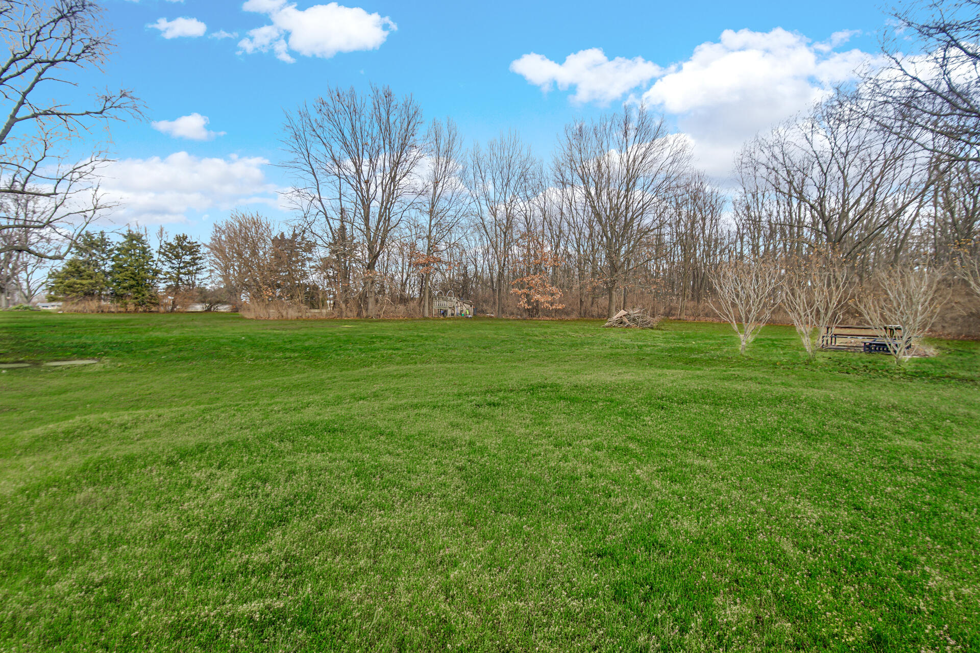 65720 Highway 4 Walkerton, IN 46574 - Photo 29 of 35 a backyard of a house with lots of green space