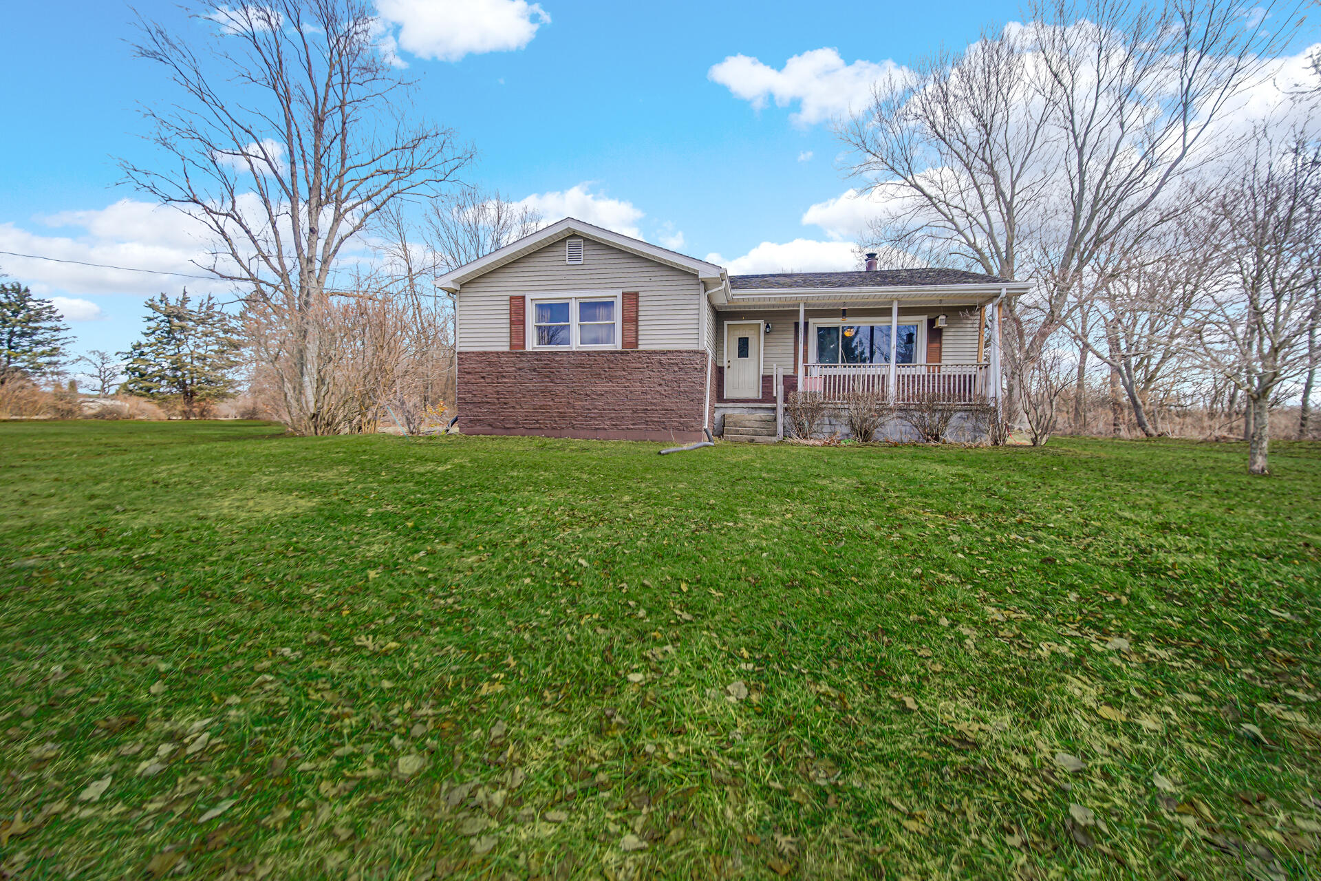 65720 Highway 4 Walkerton, IN 46574 - Photo 33 of 35 a front view of a house with a garden