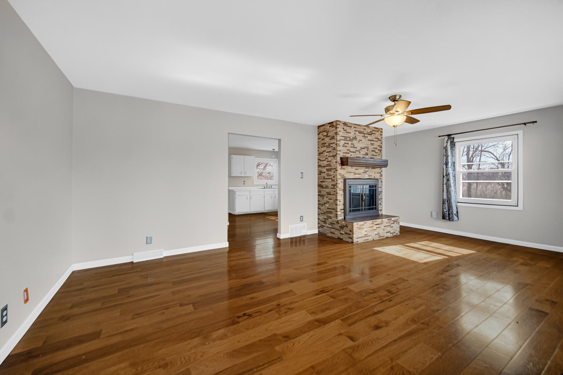 65720 Highway 4 Walkerton, IN 46574 - Photo 8 of 35 a view of empty room with wooden floor and fireplace