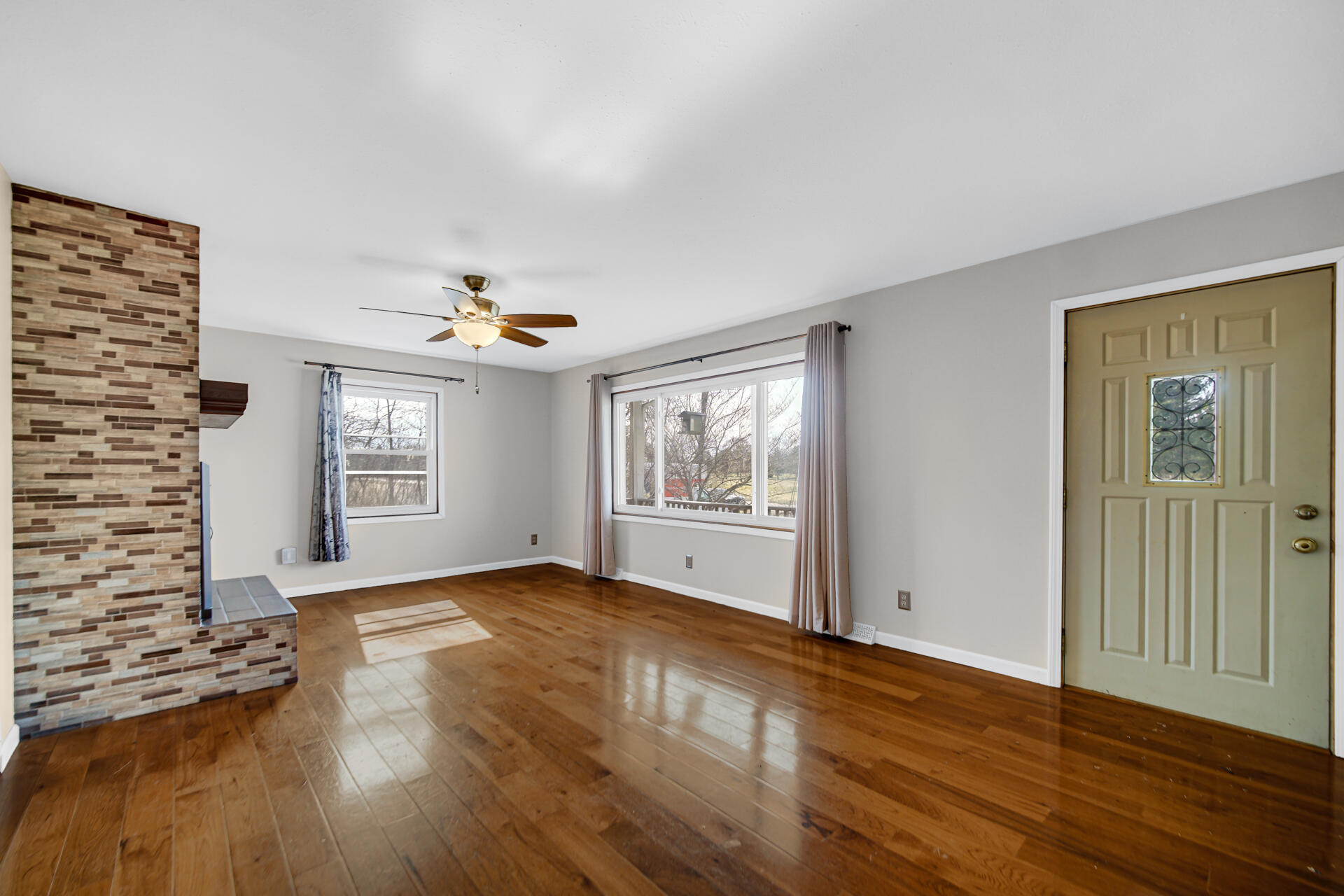 65720 Highway 4 Walkerton, IN 46574 - Photo 10 of 35 a view of an empty room with a window and wooden floor