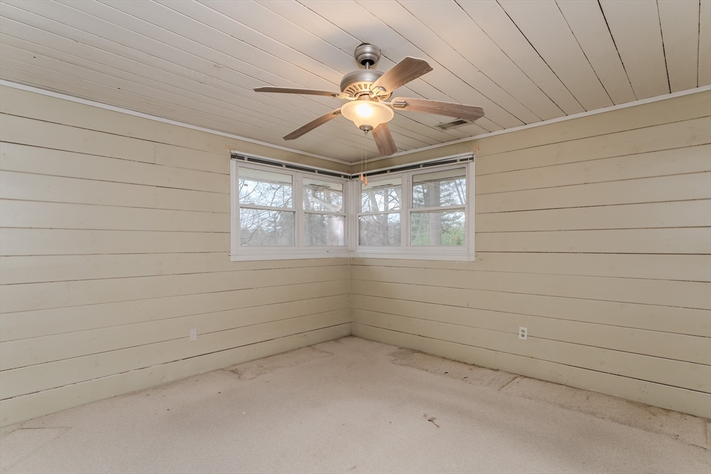411 Forest Hills Road Springfield, MA 01128 - Photo 21 of 26 en empty room with window and ceiling fan