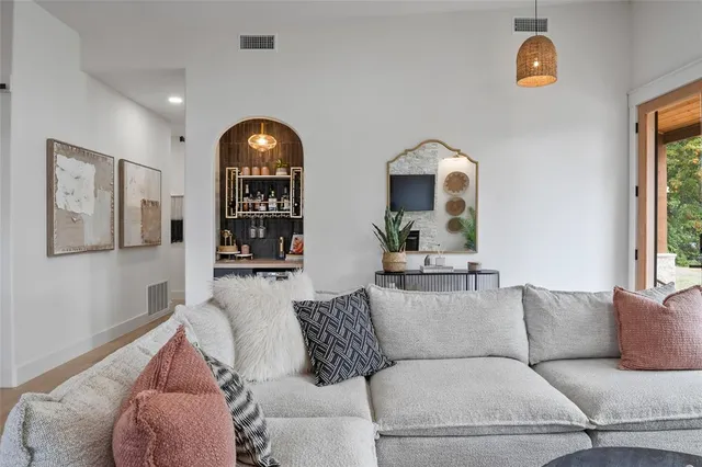 a view of a hallway to rooms and stairs