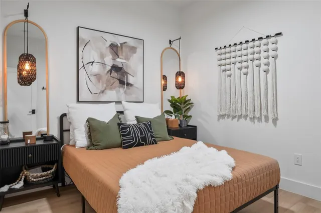 a bedroom with a bed and a chair