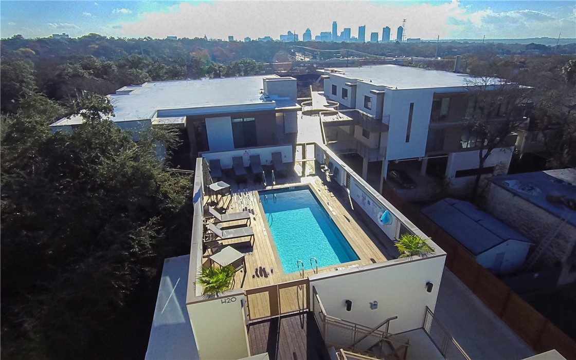 an aerial view of house with pool