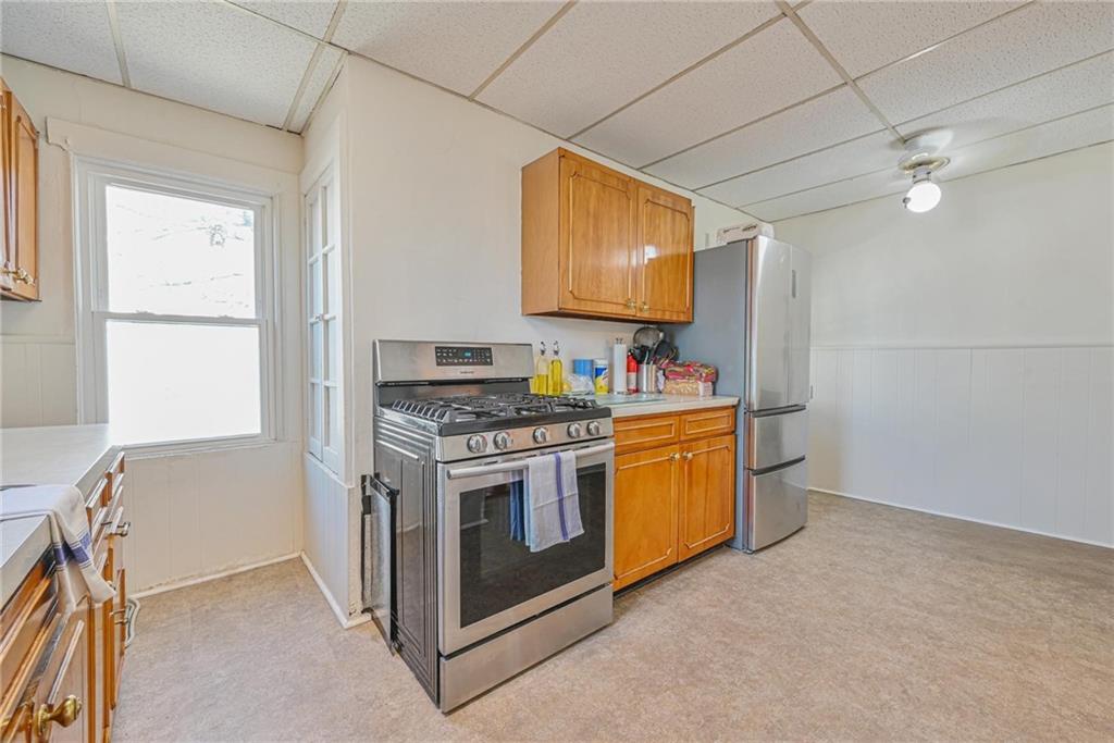 82 Battery Avenue Brooklyn, NY 11228 - Photo 15 of 26 a kitchen with stainless steel appliances granite countertop a stove and a sink