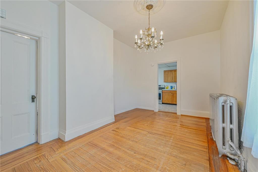 82 Battery Avenue Brooklyn, NY 11228 - Photo 16 of 26 a view of an empty room with a window