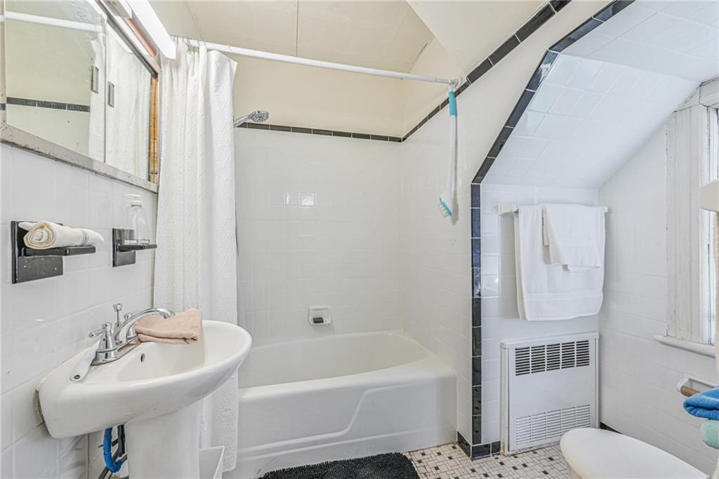 82 Battery Avenue Brooklyn, NY 11228 - Photo 17 of 26 a bathroom with a sink toilet and shower