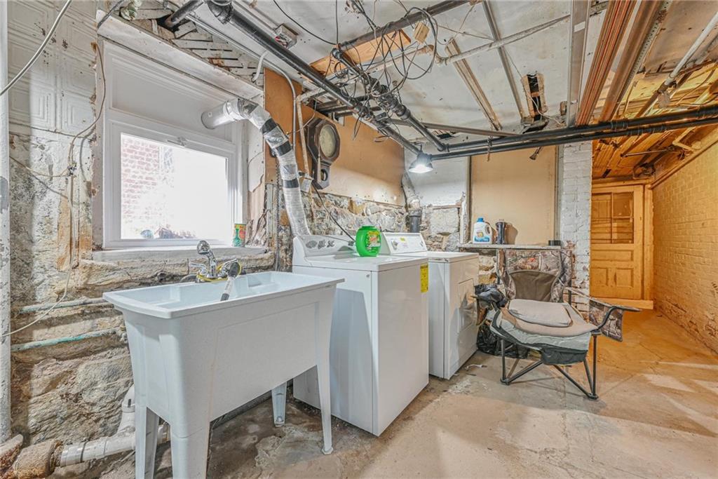 82 Battery Avenue Brooklyn, NY 11228 - Photo 21 of 26 a room with kitchen island a table and chairs
