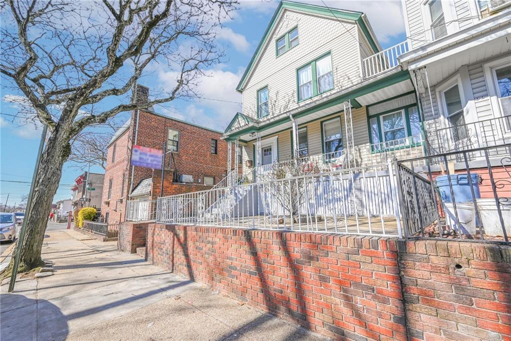 82 Battery Avenue Brooklyn, NY 11228 - Photo 3 of 26 a view of a building with a yard
