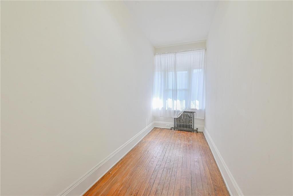 82 Battery Avenue Brooklyn, NY 11228 - Photo 6 of 26 a view of a room with wooden floor