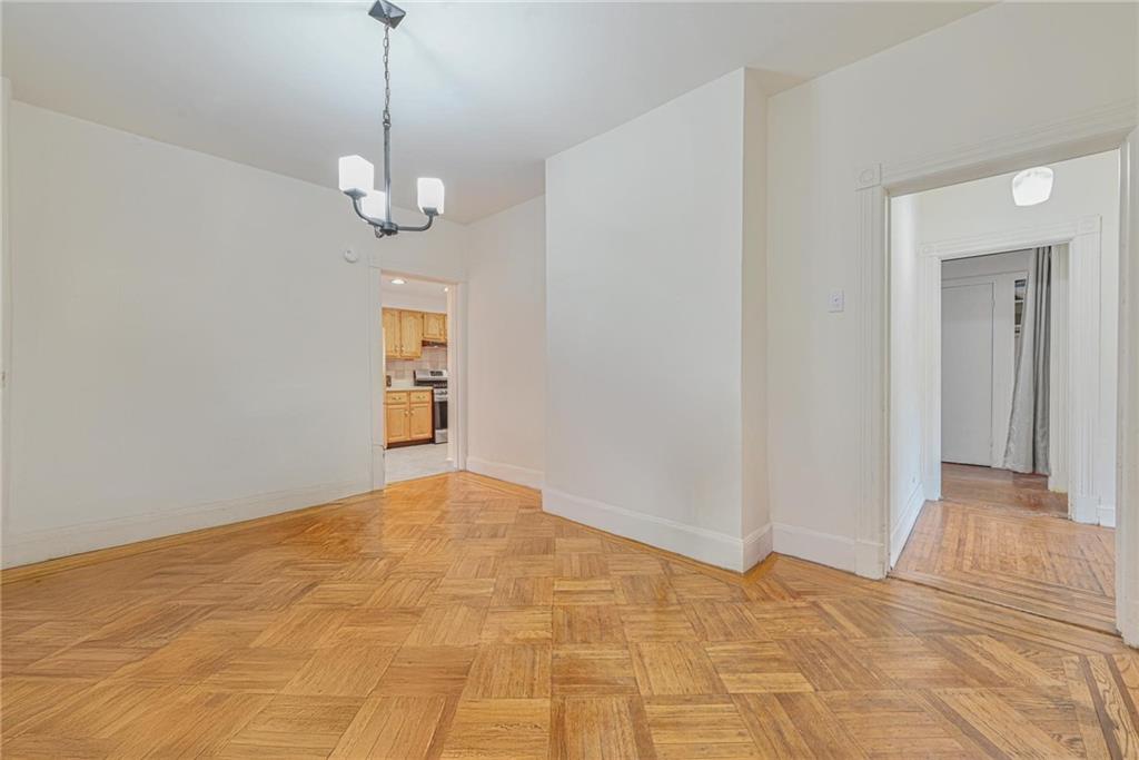 82 Battery Avenue Brooklyn, NY 11228 - Photo 9 of 26 a view of an empty room with a kitchen